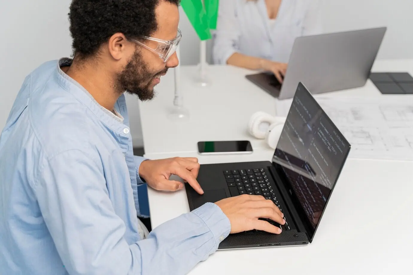 A man engaged in work on energy innovations.